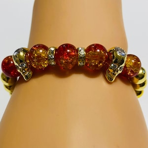 Men&#39;s Gold Hematite Bracelet: Red Crystal, CZ Skull Beads