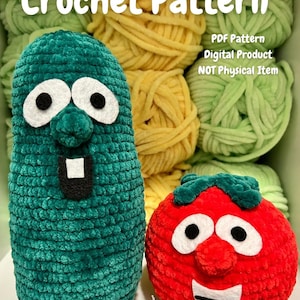 May include: A crochet pattern for a plush cucumber and tomato character. The cucumber is teal with white and black facial features. The tomato is red with green leaves and white and black facial features. The background includes skeins of yellow and green yarn.