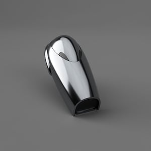 May include: A silver-coloured, futuristic-looking object with a rounded top and a slot at the bottom. The object has a smooth, metallic finish and a sleek design.