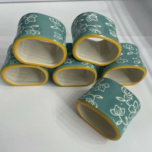 Set of 6 Temptations Napkin Rings Blue Floral Yellow Rim
