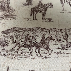 May include: Off-white fabric with a repeating sepia-toned Western-themed pattern. The design features cowboys on horseback, desert landscapes, cacti, and mountains. The fabric has a vintage, sketched aesthetic.