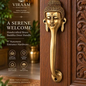 May include: A 9-inch brass door handle featuring a sculpted Buddha head at the top, mounted on a dark brown carved wooden door. The metal surface has a warm, antique gold finish with detailed facial features and a textured hair design.