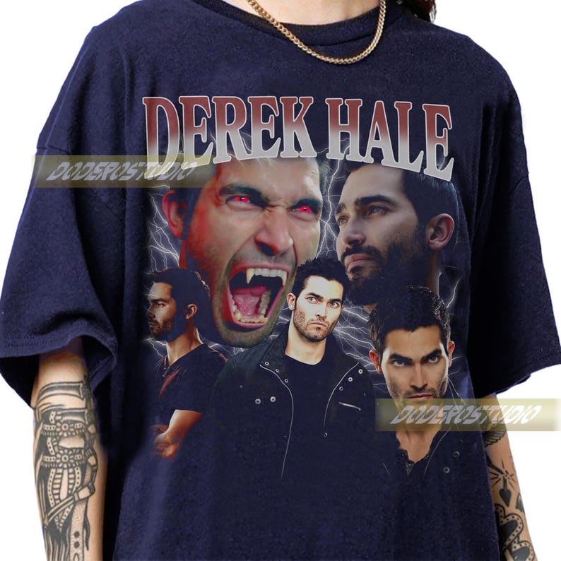 May include: Navy blue t-shirt featuring a collage of images of Derek Hale with the text "DEREK HALE" in a distressed font. The design includes images of the character with red eyes and fangs, and other portraits.