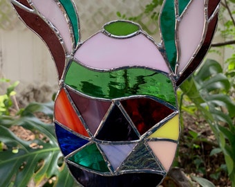 Easter Egg with Bunny Ears made from stained glass in a variety of colors.