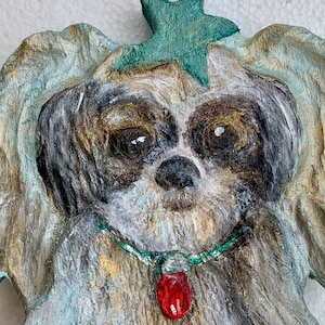 Shih Tzu Christmas ornament, carved in wood. Spread holiday cheer with this adorable dog with angel wings,  7&quot; tall by 4 1/2 &quot; wide.