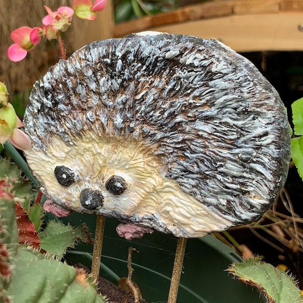 Hedgehog, cement, garden ornament. Hand made gift for gardener. Sealed for outdoors. 4" wide by 2 3/4" tall. Sturdy brass rods for soil.