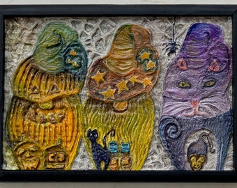 Carved, Halloween Gnomes in orange, yellow and purple. Hand made. Framed.