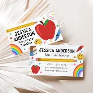 May include: Two business cards with a school theme. The cards feature the name "JESSICA ANDERSON" and the title "Substitute Teacher". The cards have illustrations of a red apple, pencil, crayon, rainbow, and smiley face. Contact information is also included.