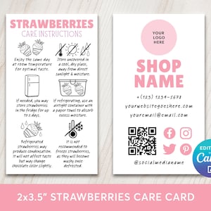 May include: A pink and white business card with strawberry care instructions and shop contact details. The card features text, illustrations, and social media icons. The dimensions are 5.08 x 8.89 cm.