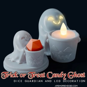 May include: Two white ghost figurines holding a small pumpkin bucket. The larger ghost has a lit LED candle inside its bucket. The smaller ghost is holding a red dice inside its bucket. The text "Trick or Treat Candy Ghost Dice Guardian and LED Decoration ARSMORIENID3D.COM" is at the bottom of the image.
