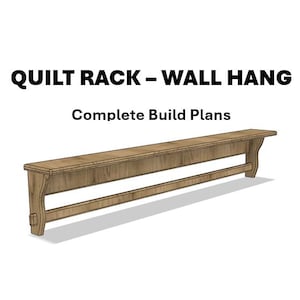 May include: A wooden quilt rack with a wall-hang design. The rack is light brown with a rectangular top and a lower support bar. The text "QUILT RACK - WALL HANG" and "Complete Build Plans" are displayed above the rack.