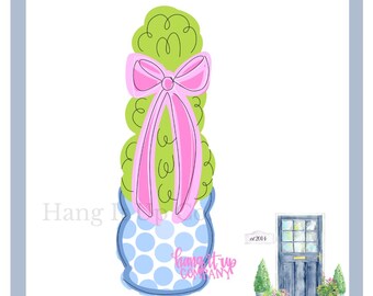 May include: A green topiary with a pink bow in a blue and white polka dot planter. The planter has the text "hang it up company" on the front. The text "est 2014" is visible in the background.