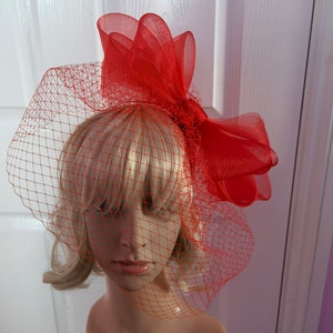 red crin fascinator with veiling wedding hat on headband ( can change into clips or comb)