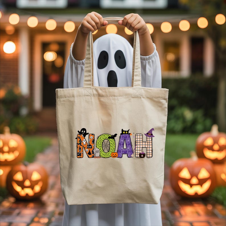A person wearing a ghost costume holds a bag with the name "Noah" printed on it, standing in front of jack-o-lanterns.