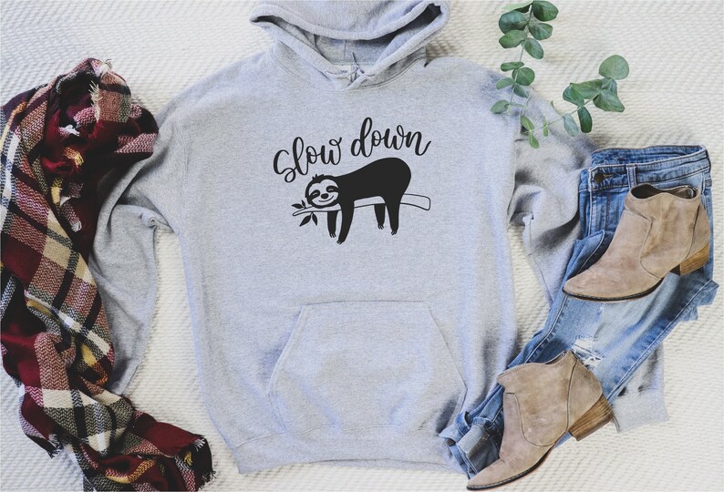 May include: Gray hooded sweatshirt with a black sloth graphic and the text "Slow down".