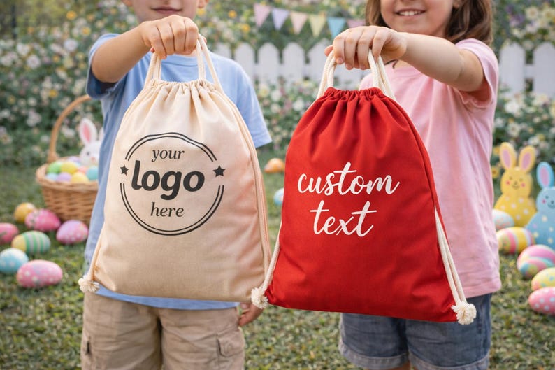 Two children holding bags with custom text printed on them, standing in front of a garden with Easter decorations.