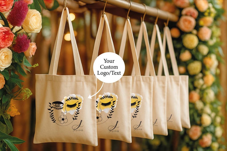 A row of beige tote bags with floral designs, each with a custom text label.