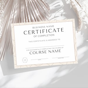 May include: A certificate of completion with a beige border and decorative swirls. The text reads "Business Name Certificate of Completion" and includes spaces for the recipient's name, course name, date, and signature.