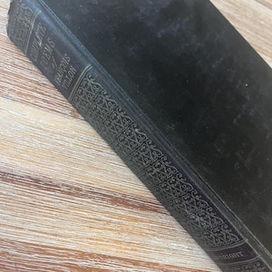 May include: Black leather-bound book with gold lettering on the spine. The title is "Complete Poems of Francois Villon".