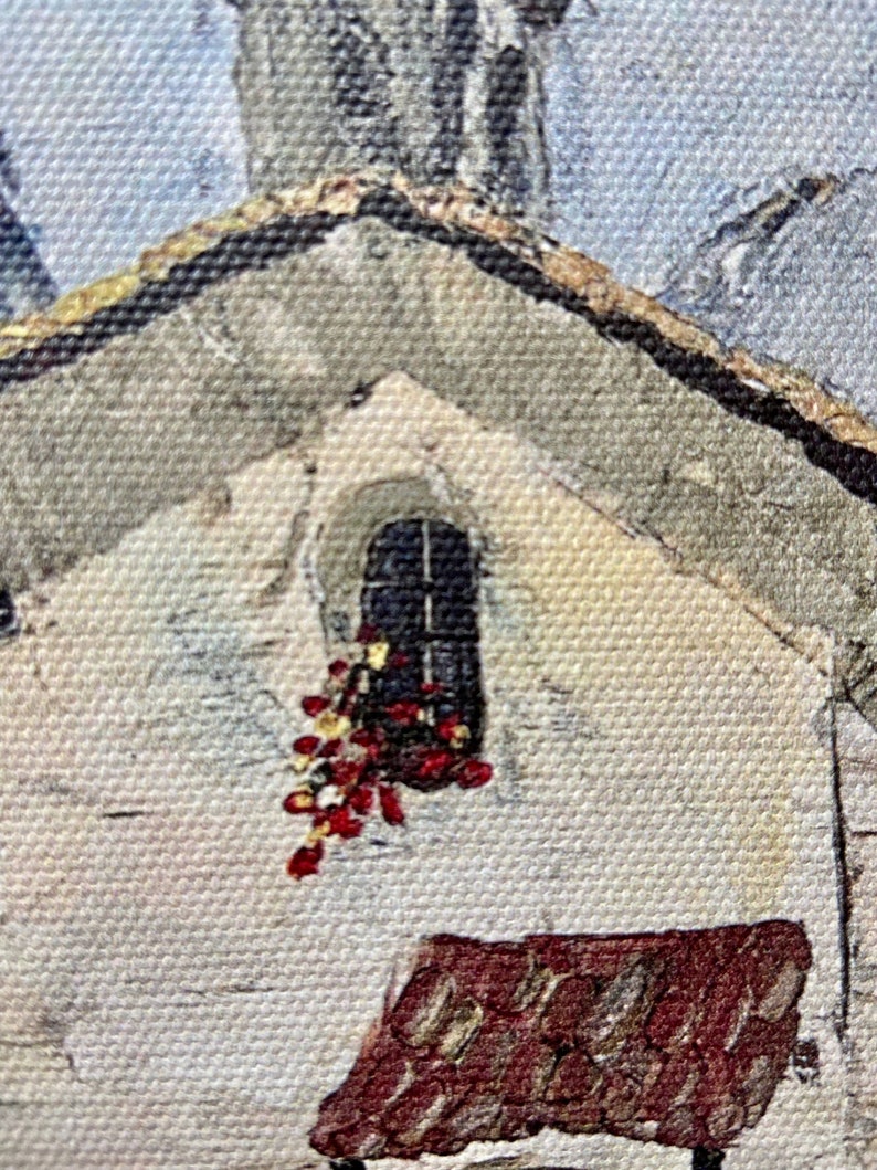 May include: A painting of a small, white building with a red brick roof. There is a window with a red flower garland hanging from it. The building is set against a blue sky.