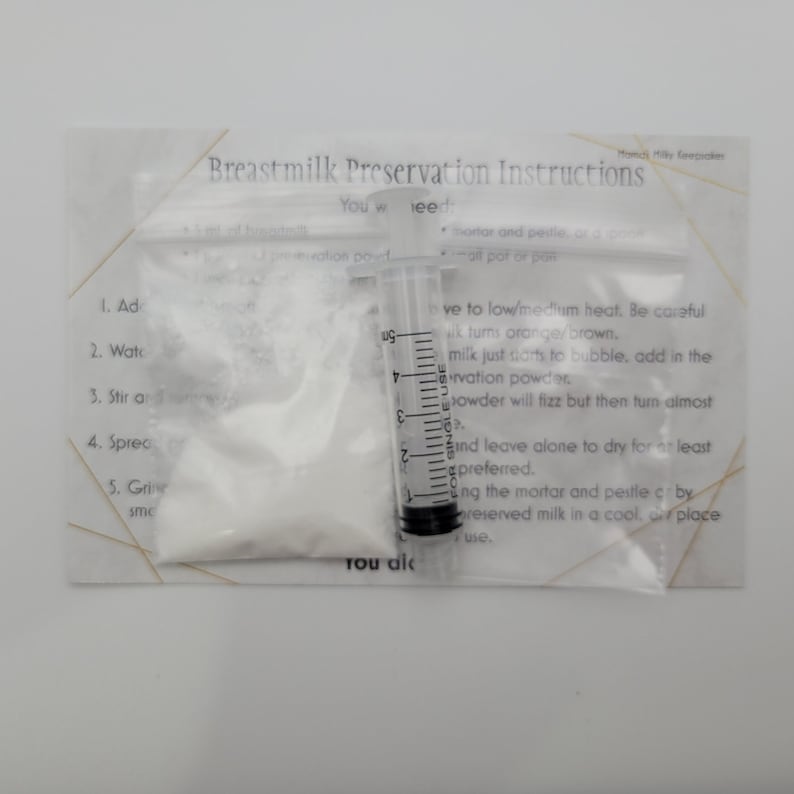 May include: A white powder in a clear plastic bag with instructions for breast milk preservation. The instructions include adding water, stirring, spreading, and grinding the powder with a mortar and pestle. A clear plastic syringe with a single-use label is also included.