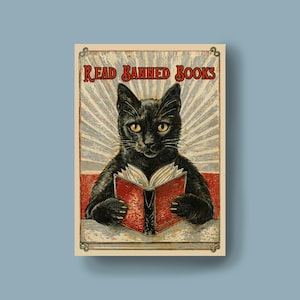 May include: A vintage-style poster with a black cat reading a red book. The poster has the text "Read Banned Books" in a red banner at the top.