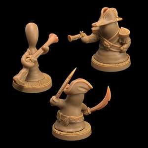 May include: Three miniature figurines of brown clay, each depicting a pirate with a different weapon. One pirate holds a sword, another holds a pistol, and the third holds a musket. The pirates are wearing hats and have a cartoonish appearance.