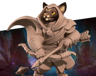 May include: A brown and tan cat figurine wearing a hooded cloak and holding a bow and arrow. The figurine is standing on a base with a mushroom and grass.