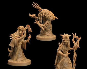May include: Three miniature figures of witches, each with a different pose and holding a staff or other magical object. The figures are painted in a brown color and are standing on round bases.