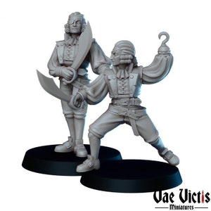 May include: Two gray painted miniature figures of pirates, one with a sword and the other with a hook hand. The figures are standing on black circular bases.