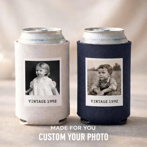 Two custom-made photo can holders, each featuring a black and white photograph of a young child. The text on the can holders reads "VINTAGE 1992" and "VINTAGE 1992", indicating the vintage year of the photos. The phrase "MADE FOR YOU CUSTOM YOUR PHOTO" is displayed at the bottom of the image, suggesting that these can holders are personalized for individual use.
