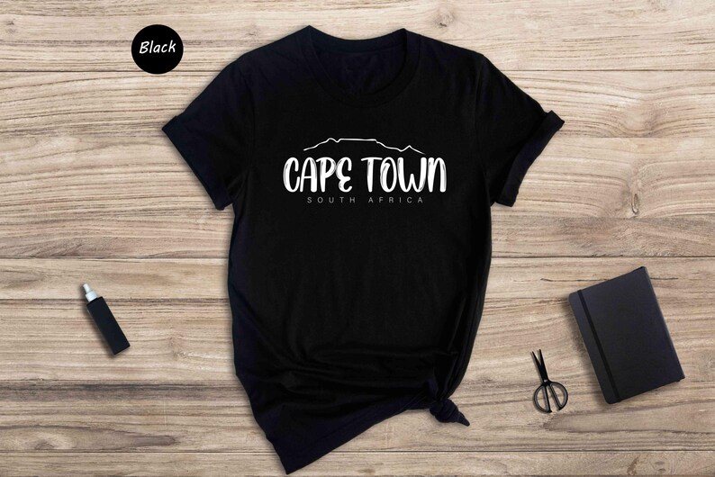 a black t - shirt with cape town written on it
