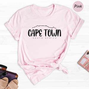 a pink t - shirt with the words cape town on it