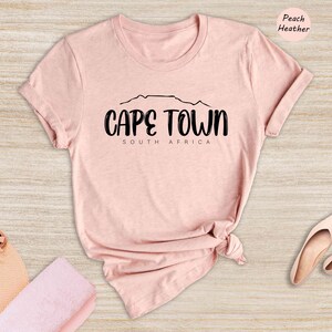 a pink shirt with the words cape town on it