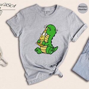 Dino Lover Gift Tee: Dinosaur Eating Pizza Design, Funny Dino Pizza Shirt | Cotton Blend, Unisex Sizes XS-XXL image 2