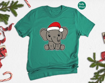 Camiseta navideña de elefante bebé adorable, camiseta de elefante con gorro de Papá Noel, camiseta divertida de animales navideños, regalo navideño para amantes de los elefantes, camiseta para niños y adultos.