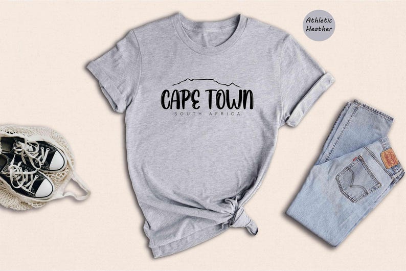 a t - shirt that says cape town with a pair of sneakers
