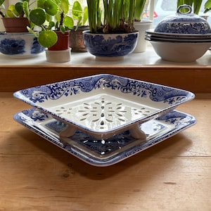 May include: A set of three ceramic mugs with a speckled, matte finish. The mugs are in shades of cream, light gray, and dark gray. Each mug has a simple, minimalist design, perfect for coffee or tea.