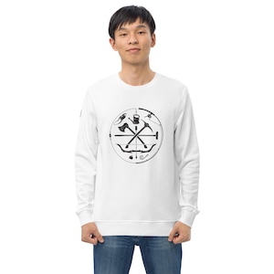 May include: White long-sleeved sweatshirt featuring a black and white graphic of a compass with various tools, including an axe, a hammer, a fishing rod, and a bow and arrow.