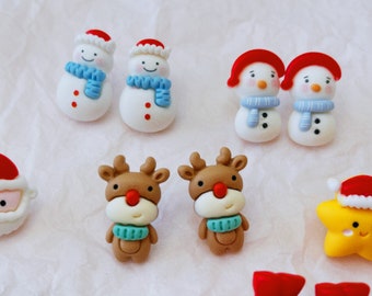 May include: Assortment of Christmas-themed clay ornaments, including snowmen, reindeer, and a star. The ornaments are white, brown, red, and yellow.
