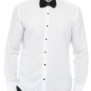 May include: A white long-sleeve dress shirt with a black bow tie. The shirt has a button-up front and a classic collar.