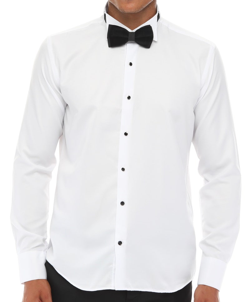 May include: A white long-sleeve dress shirt with a black bow tie. The shirt has a button-up front and a classic collar.