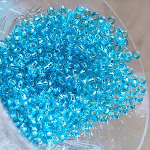 Perline di vetro ceco 9/0-25g/50g, Preciosa Czech Rocailles, zuppa di perline d'argento blu trasparente, perline per la creazione di gioielli, fai da te