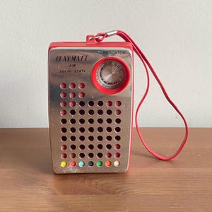Vintage playmate pocket radio - 4” t x 2.8” w x 1.5” d - not tested
