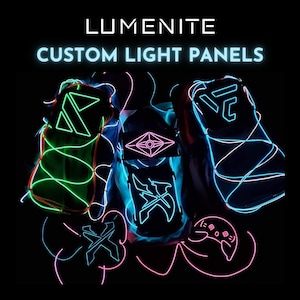 May include: Custom light panels with neon green, blue, and pink lights. The panels are shaped like a triangle, a diamond, a letter "C", and a letter "X". The panels are on a black background. LUMENITE CUSTOM LIGHT PANELS.