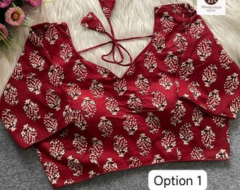 May include: A burgundy blouse with a white leaf pattern. The blouse has a V-neck and long sleeves. The text "Option 1" is displayed in a white rectangle. The Trendyculture Indya logo is in the upper right corner.