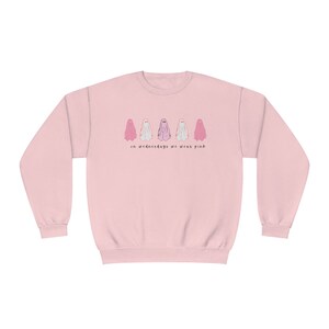 Unisex NuBlend® Crewneck Sweatshirt: on Wed we wear pink ghosts
