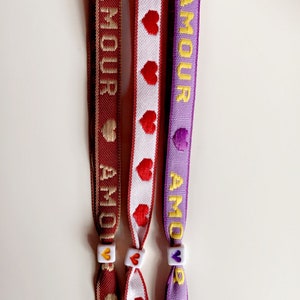 Vrolijke Lint armbandjes: jadore, smiley, dream, love, let love rule, golfjes, pijltjes of hartjes. afbeelding 6
