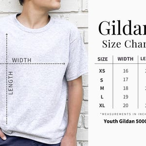 May include: A light gray Gildan youth t-shirt with a size chart. The chart shows measurements in inches for sizes XS to XL. The shirt is being modeled, with the width and length measurements indicated on the shirt.