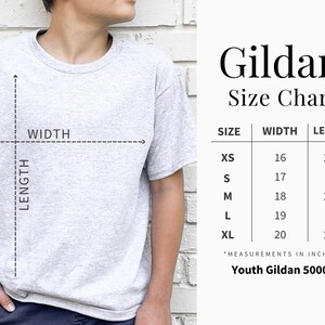 May include: A light grey t-shirt with a size chart titled Gildan Size Chart. The chart lists sizes XS through XL with corresponding width and length measurements in inches for the Youth Gildan 5000B model, indicated by dashed lines on the shirt.